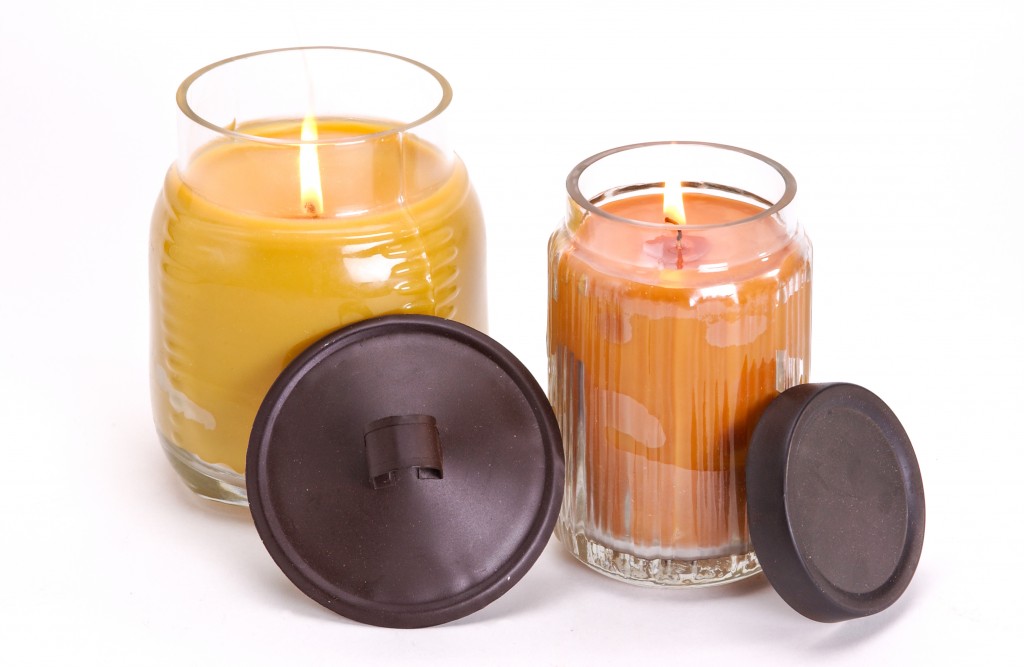 Assortment of decorative scented candles shot on a white background.