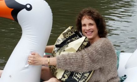 Midwife rides inflatable swan through flood to deliver baby