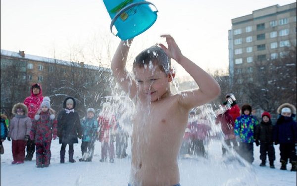 Siberian children pour ice water on their heads while standing in swimsuits in snow for ONE reason (this is NOT a punishment)