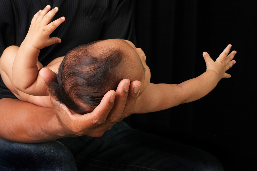 Holding infants — or not — can leave traces on their genes