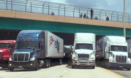 Truckers park under overpass after man threatens to jump off