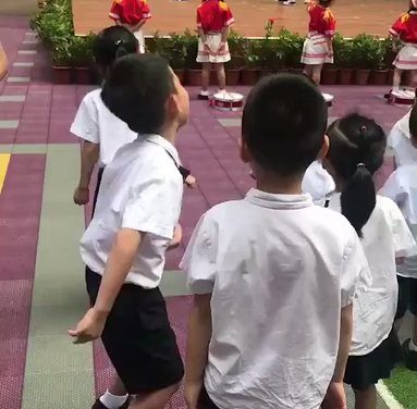 Chinese school welcomes kids with a pole dancer