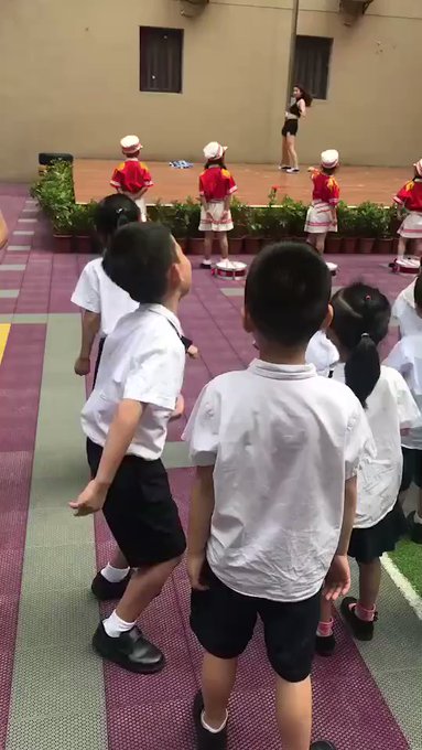Chinese school welcomes kids with a pole dancer
