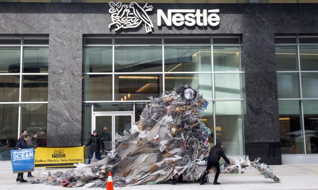 Activists deliver giant trash monsters to Nestlé headquarters to protest plastic pollution